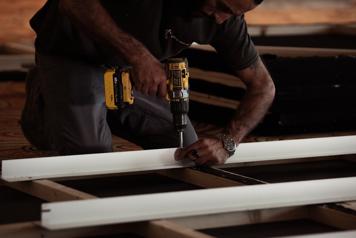 SMMJ Pty Ltd carpenter fitting a timber trim